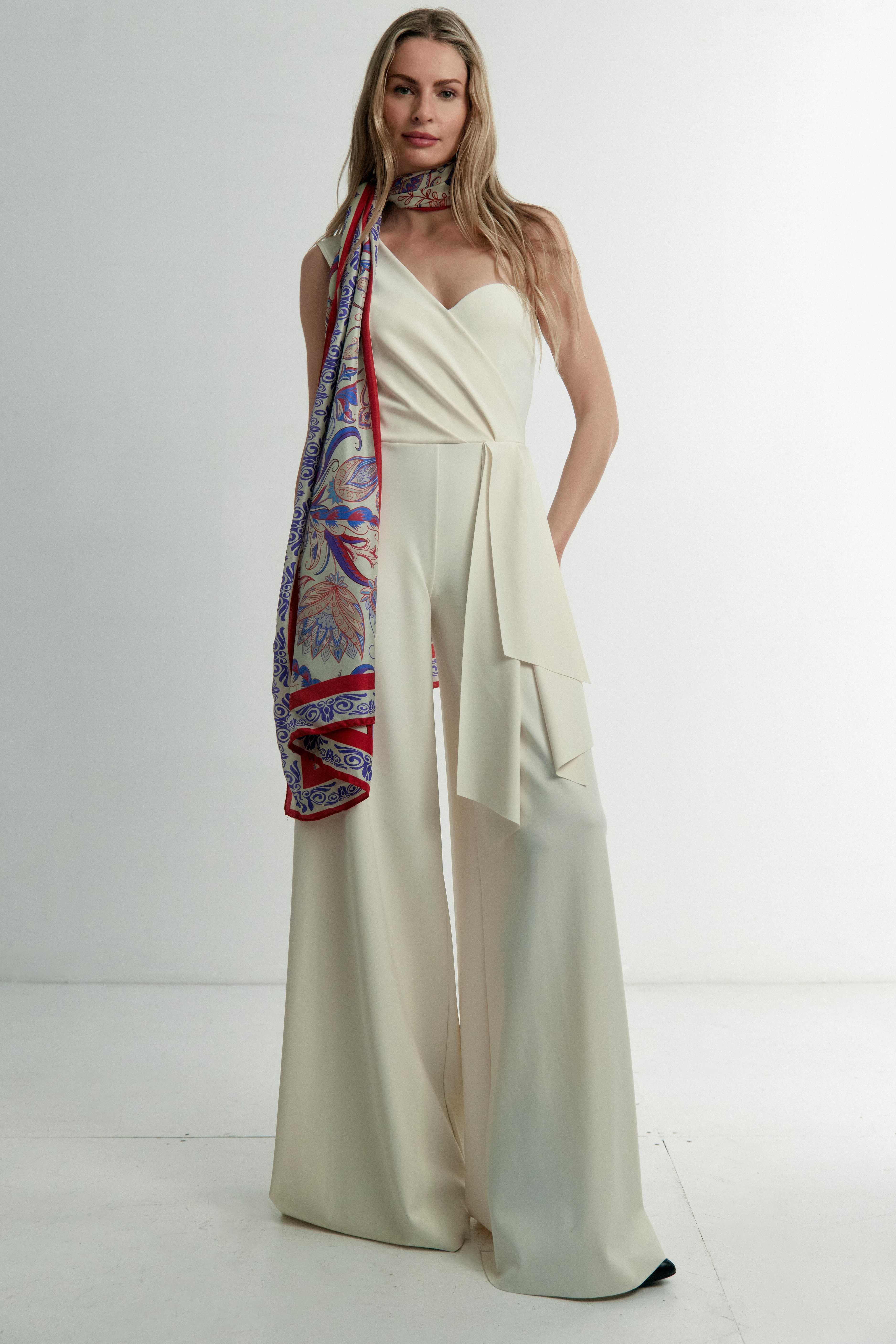 Model wearing the Rubino red and blue silk scarf wrapped around her neck — chic and elegant styling with Italian silk twill.